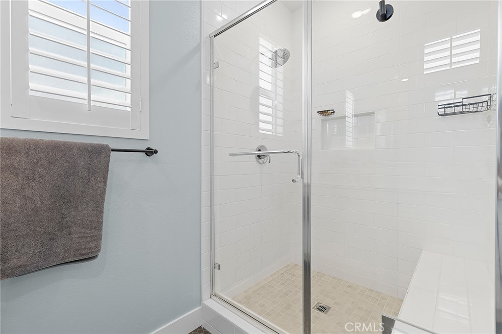 705 Arrowleaf Road Rancho Mission Viejo, CA 92694 - Photo 19 of 48 a bathroom with a glass shower door