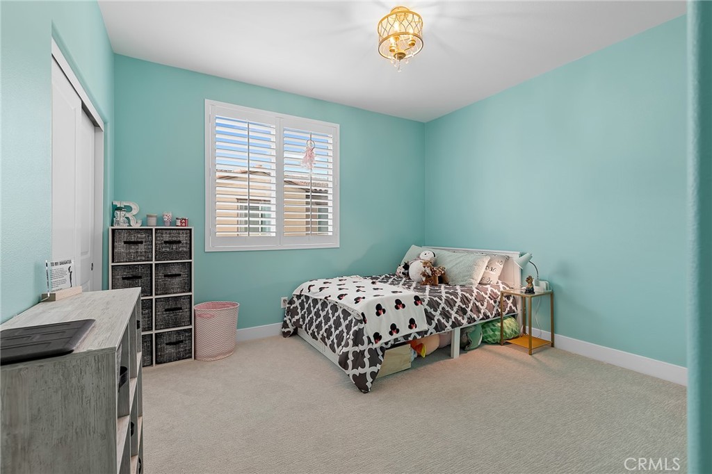 705 Arrowleaf Road Rancho Mission Viejo, CA 92694 - Photo 20 of 48 a bedroom with bed and a window