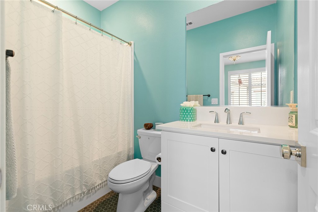 705 Arrowleaf Road Rancho Mission Viejo, CA 92694 - Photo 24 of 48 a bathroom with a sink toilet and mirror