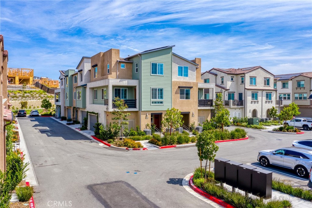 705 Arrowleaf Road Rancho Mission Viejo, CA 92694 - Photo 26 of 48 a front view of a building with street view