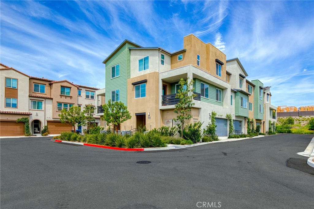 705 Arrowleaf Road Rancho Mission Viejo, CA 92694 - Photo 27 of 48 a front view of a house with a yard