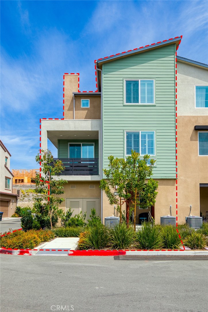 705 Arrowleaf Road Rancho Mission Viejo, CA 92694 - Photo 28 of 48 a front view of house with garage and flowers