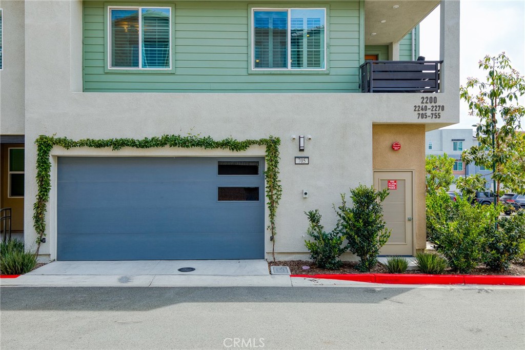 705 Arrowleaf Road Rancho Mission Viejo, CA 92694 - Photo 29 of 48 a yellow building with trees in front of it