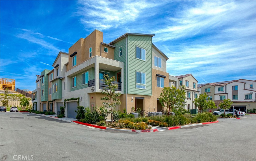 705 Arrowleaf Road Rancho Mission Viejo, CA 92694 - Photo 31 of 48 a front view of a building with cars