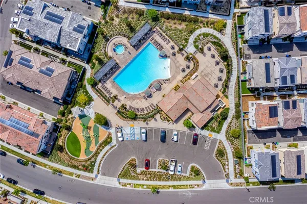 an aerial view of residential houses and outdoor space
