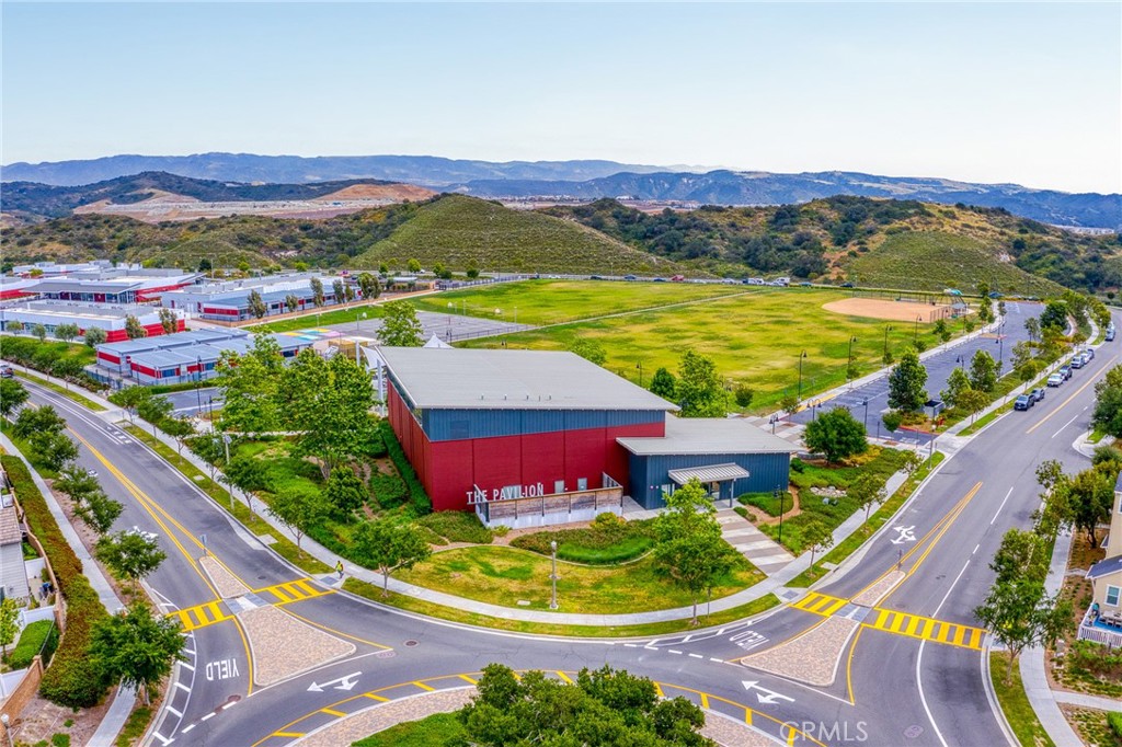 705 Arrowleaf Road Rancho Mission Viejo, CA 92694 - Photo 40 of 48 a view of a swimming pool with a table and chairs