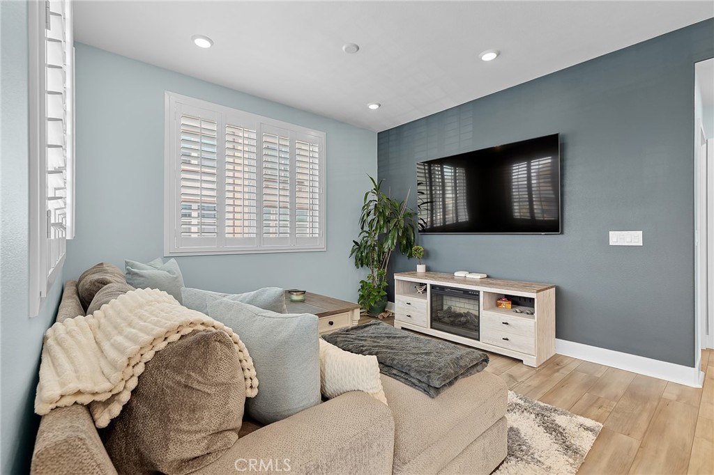 705 Arrowleaf Road Rancho Mission Viejo, CA 92694 - Photo 9 of 48 a living room with furniture and a flat screen tv
