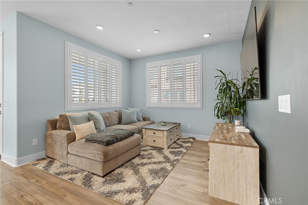 705 Arrowleaf Road Rancho Mission Viejo, CA 92694 - Photo 10 of 48 a living room with furniture and a window