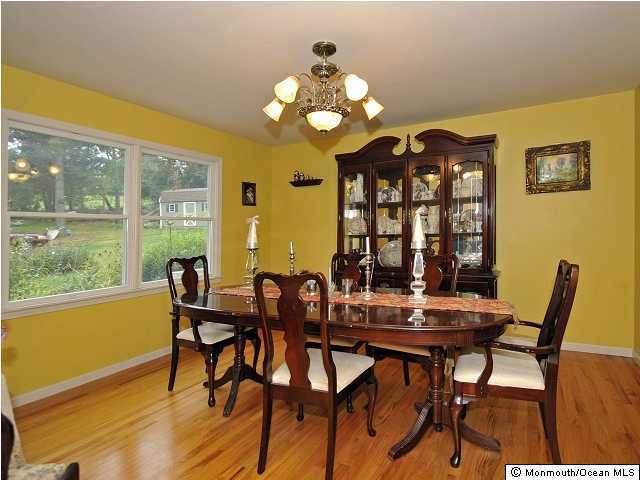 134 Waterworks Road Freehold, NJ 07728 - Photo 3 of 3 a view of a dining room with furniture and a large window