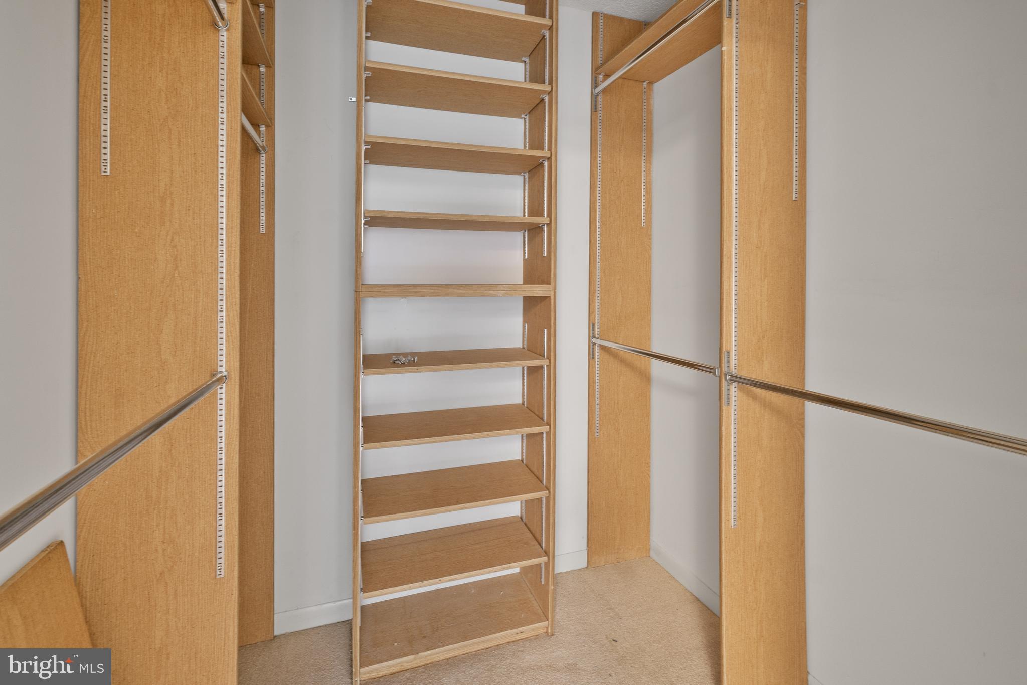15300 Beaverbrook Court, Unit 883F Silver Spring, MD 20906 - Photo 17 of 31 a view of walk in closet with empty racks