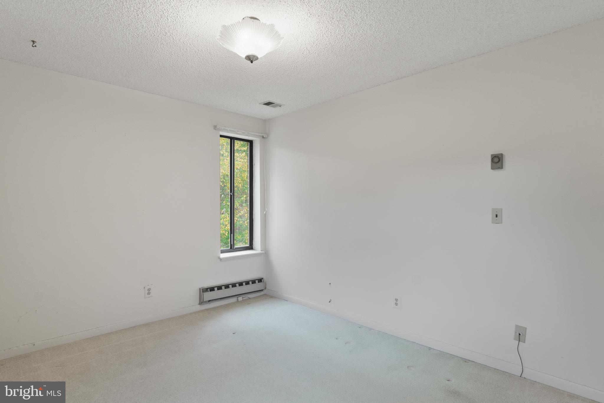 15300 Beaverbrook Court, Unit 883F Silver Spring, MD 20906 - Photo 19 of 31 an empty room with a window