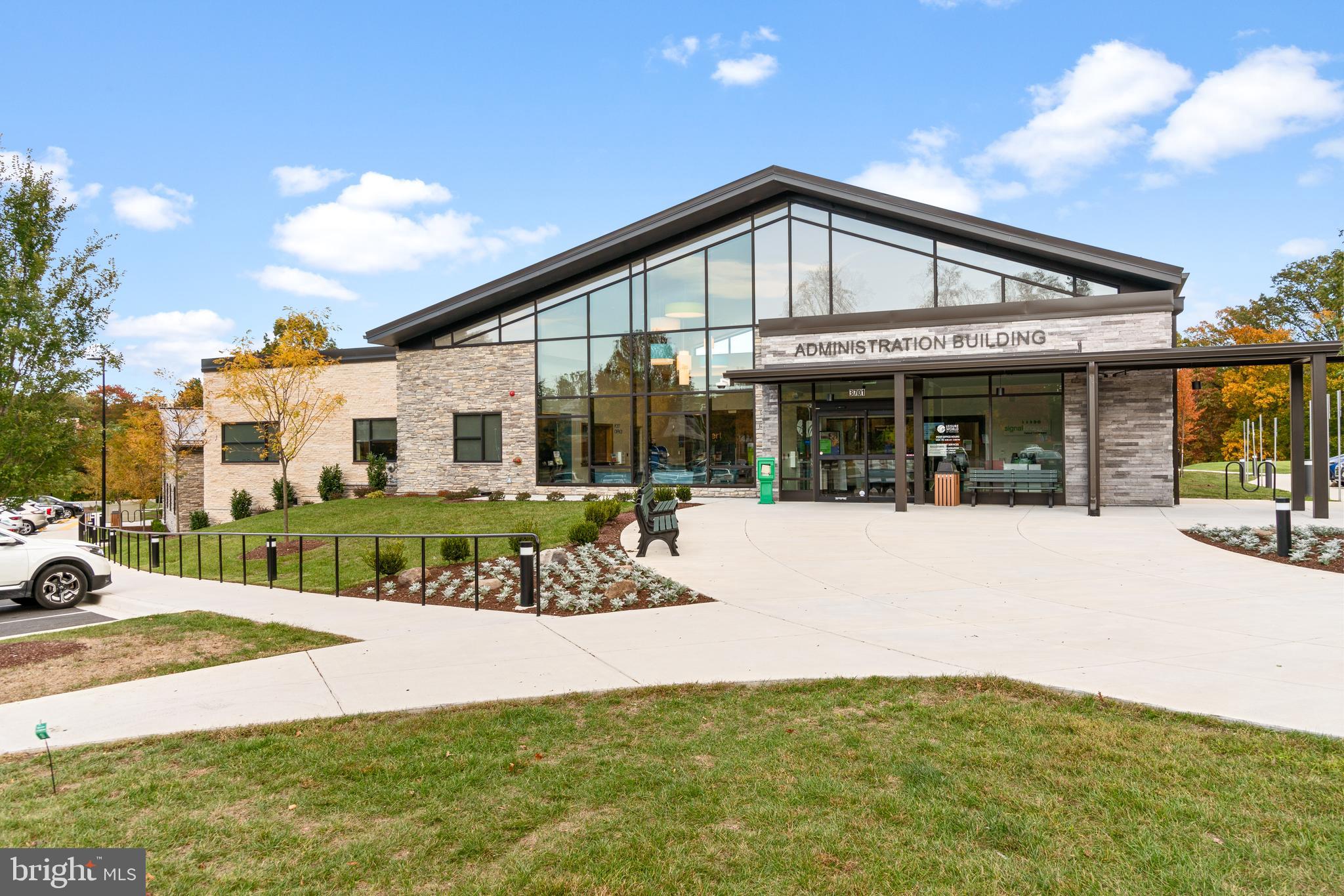 15300 Beaverbrook Court, Unit 883F Silver Spring, MD 20906 - Photo 22 of 31 a front view of a house with a yard table and chairs