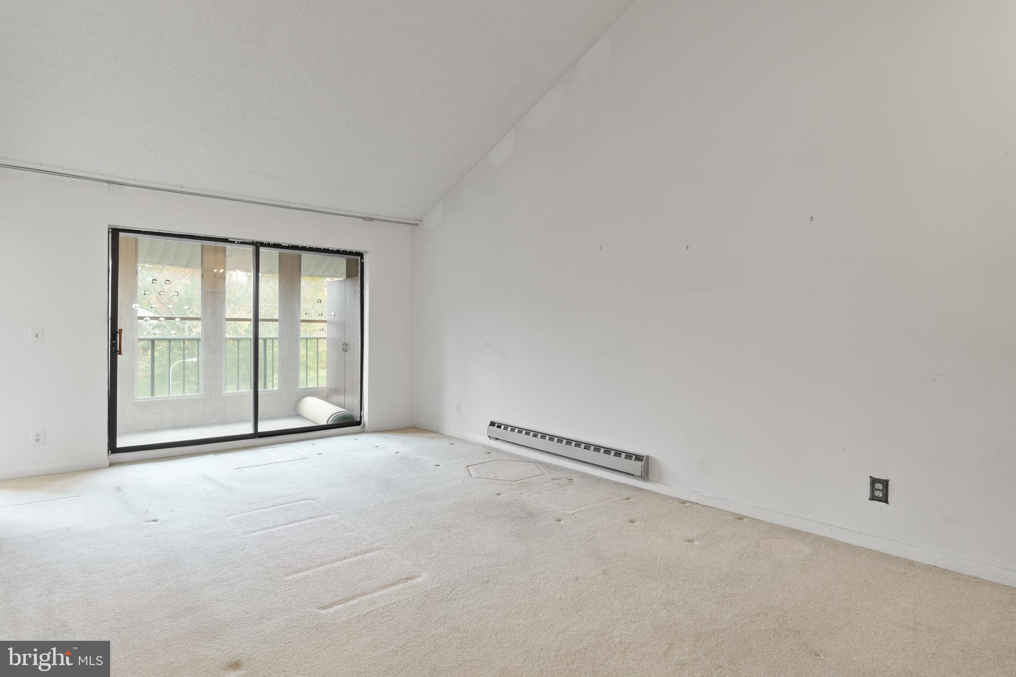 15300 Beaverbrook Court, Unit 883F Silver Spring, MD 20906 - Photo 5 of 31 a view of an empty room with a window