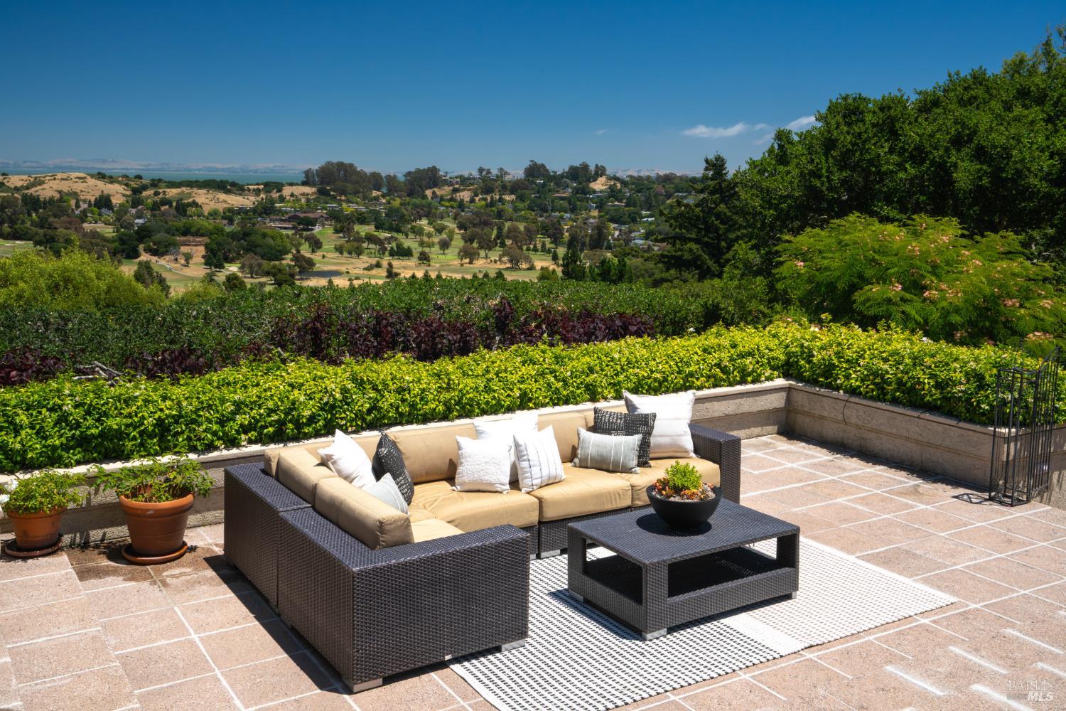 82 McNear Drive San Rafael, CA 94901 - Photo 3 of 54 a view of a couches in a patio with a garden view