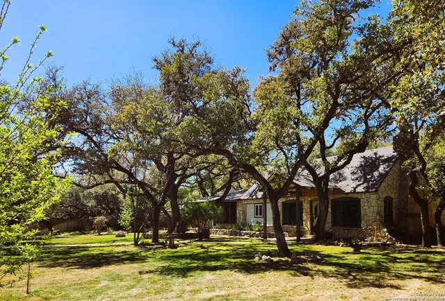 a view of a house with a yard of the house