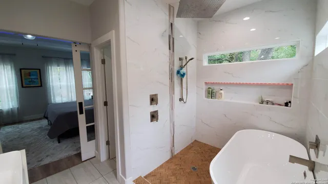 a bathroom with a sink a toilet and bathtub