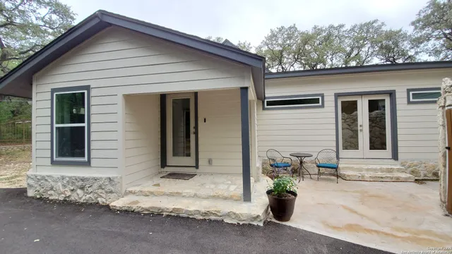a view of a yard with yellow plants