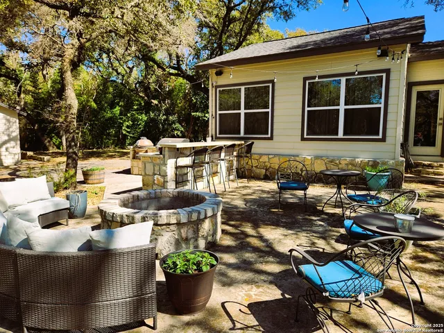 a view of a house with swimming pool and porch