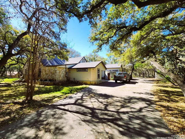 a view of swimming pool with trees