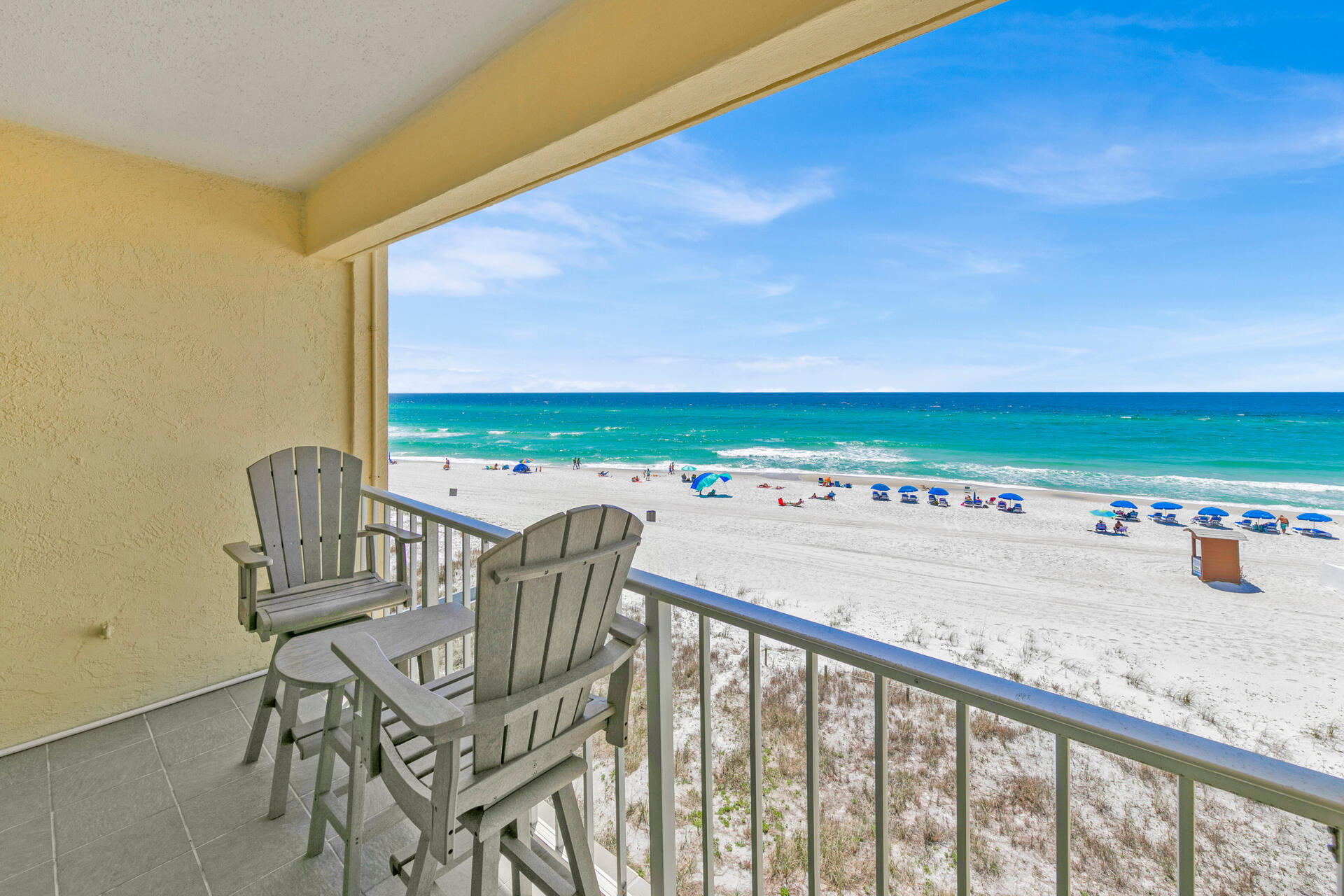 15413 Front Beach Road, Unit 406 Panama City Beach, FL 32413 - Photo 1 of 21 a view of a balcony with chair and table