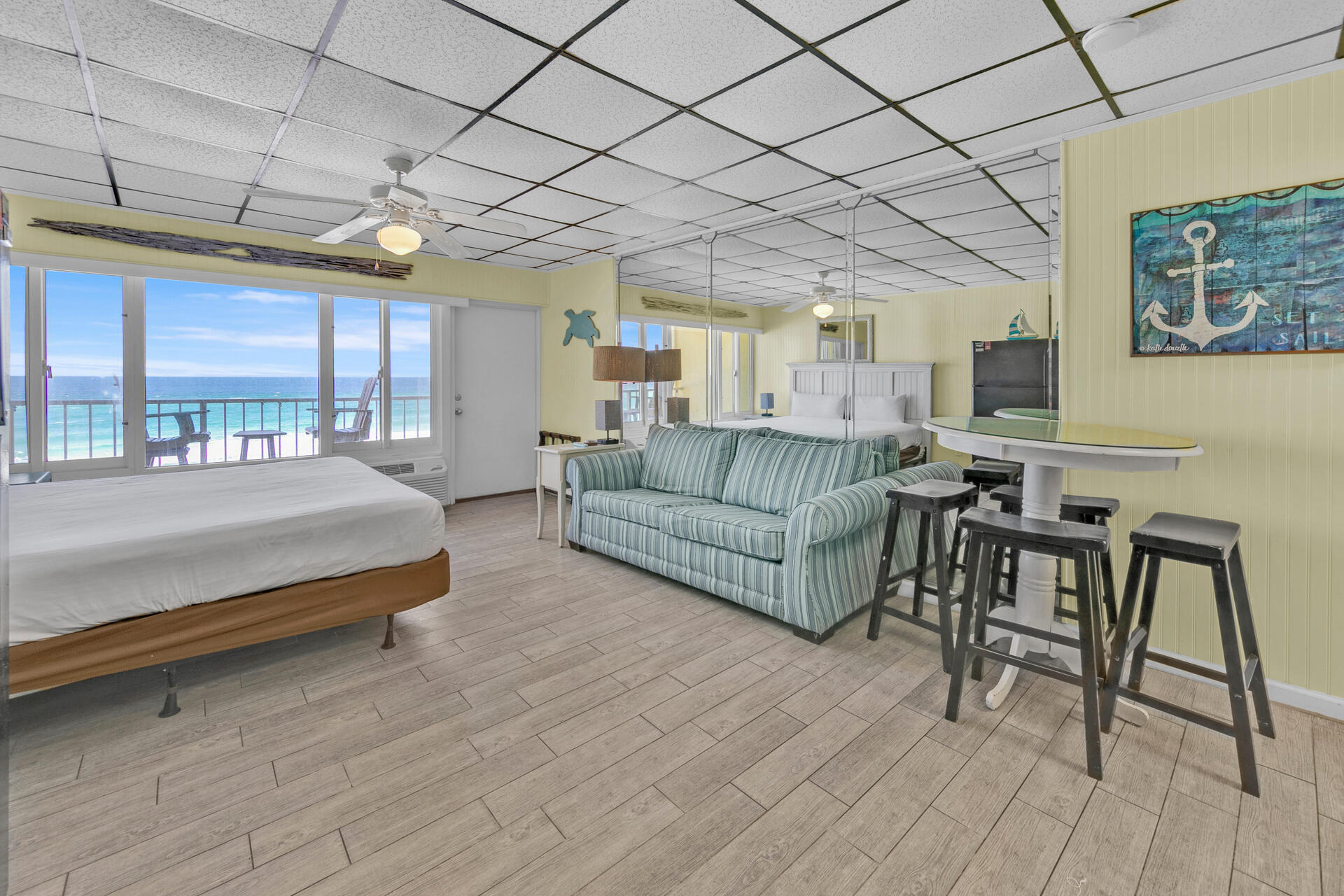 15413 Front Beach Road, Unit 406 Panama City Beach, FL 32413 - Photo 5 of 21 a living room with furniture and a table