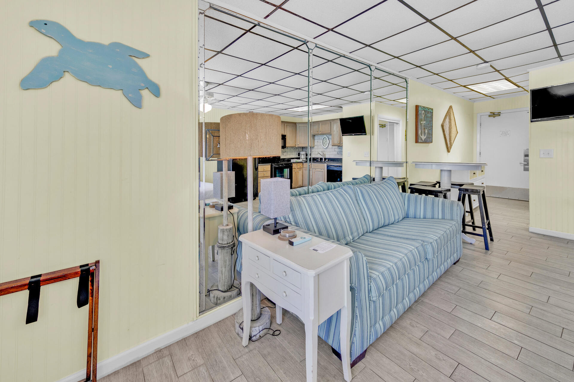 15413 Front Beach Road, Unit 406 Panama City Beach, FL 32413 - Photo 6 of 21 a living room with furniture and a wooden floor