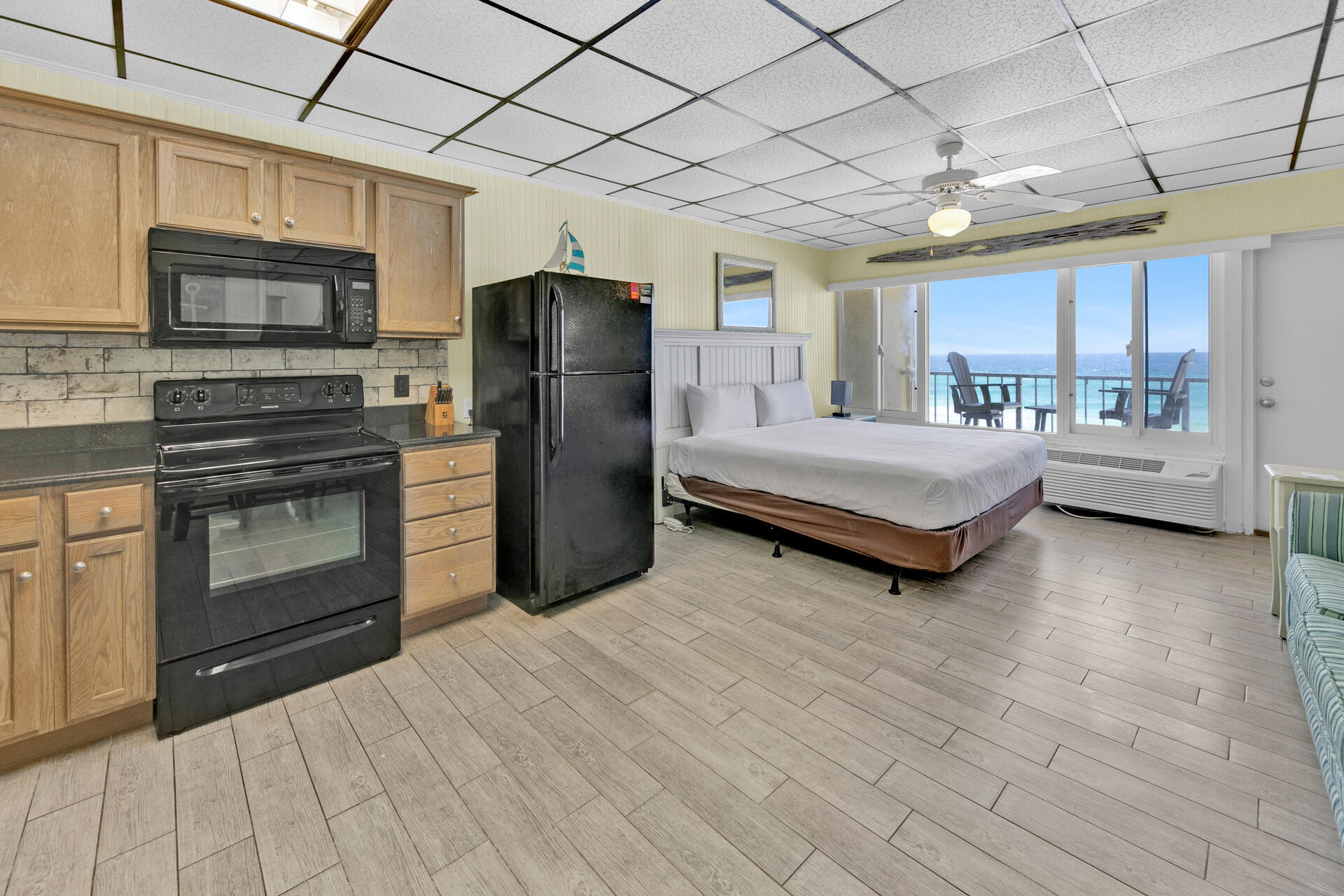 15413 Front Beach Road, Unit 406 Panama City Beach, FL 32413 - Photo 8 of 21 a room with bed and cabinets