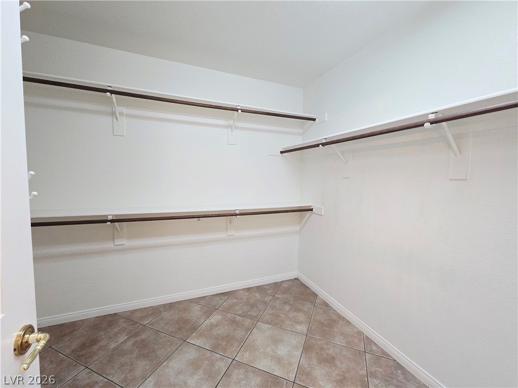 1265 Moon Vision Street Henderson, NV 89052 - Photo 22 of 35 Walk in closet with light tile patterned floors