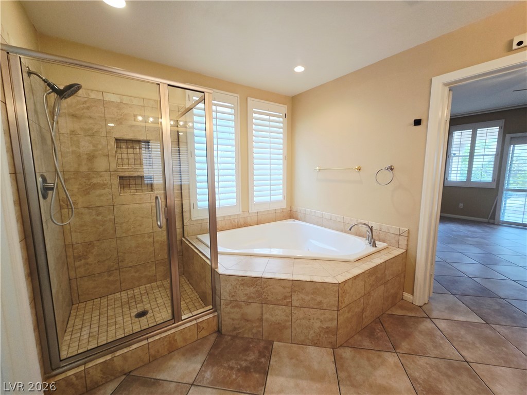 1265 Moon Vision Street Henderson, NV 89052 - Photo 24 of 35 Bathroom featuring a garden tub, a stall shower, tile patterned flooring, healthy amount of natural light, and recessed lighting