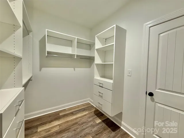 a view of an empty walk in closet