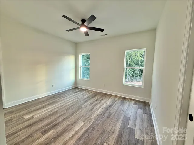 a spacious bathroom with a double vanity sink and mirror