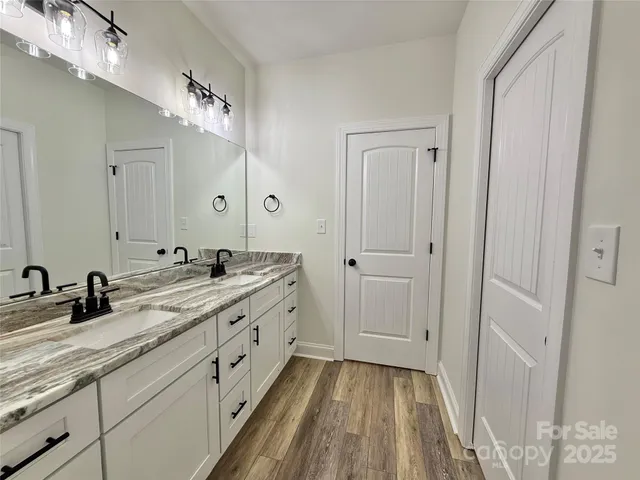 a white toilet sitting next to a bath tub