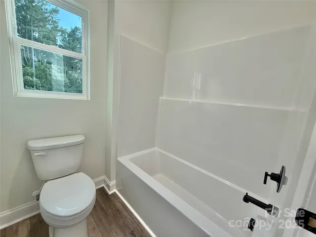 a view of an empty room and a windows