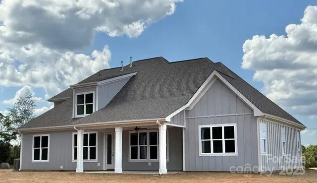 a view of a livingroom with furniture and a ceiling fan