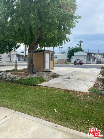 a view of a yard with an outdoor space