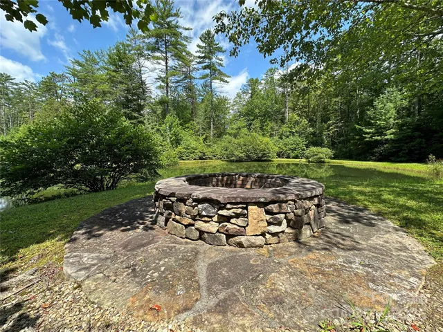 a view of a yard with table and chairs