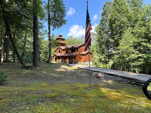 a view of a swimming pool with a yard