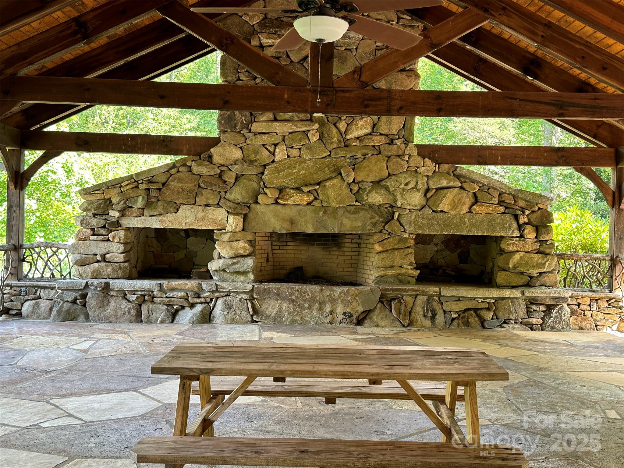 67 Peppervine Circle Rosman, NC 28772 - Photo 7 of 48 a view of living room with patio furniture and a flat screen tv
