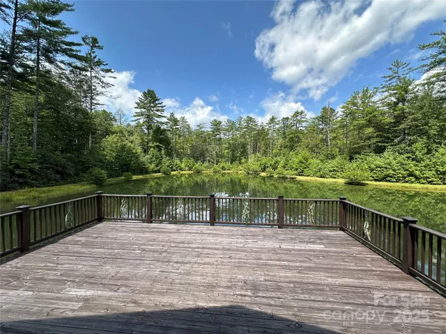 a view of swimming pool with a lake view