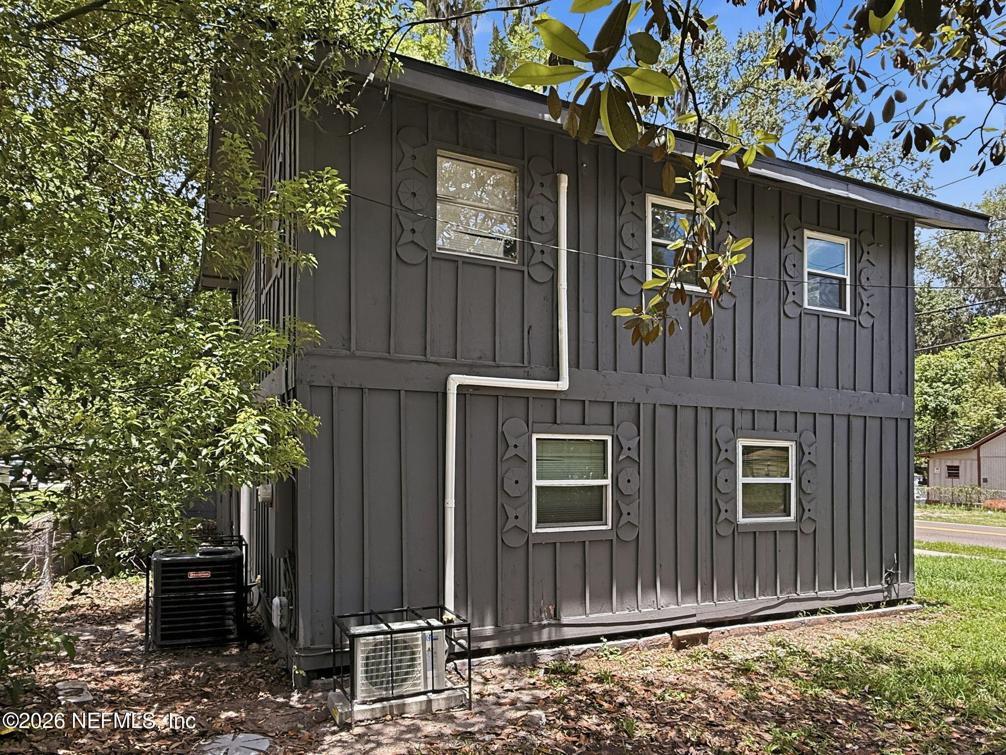 326 Cahoon Road South Jacksonville, FL 32220 - Photo 26 of 34 a front view of a house with a garden