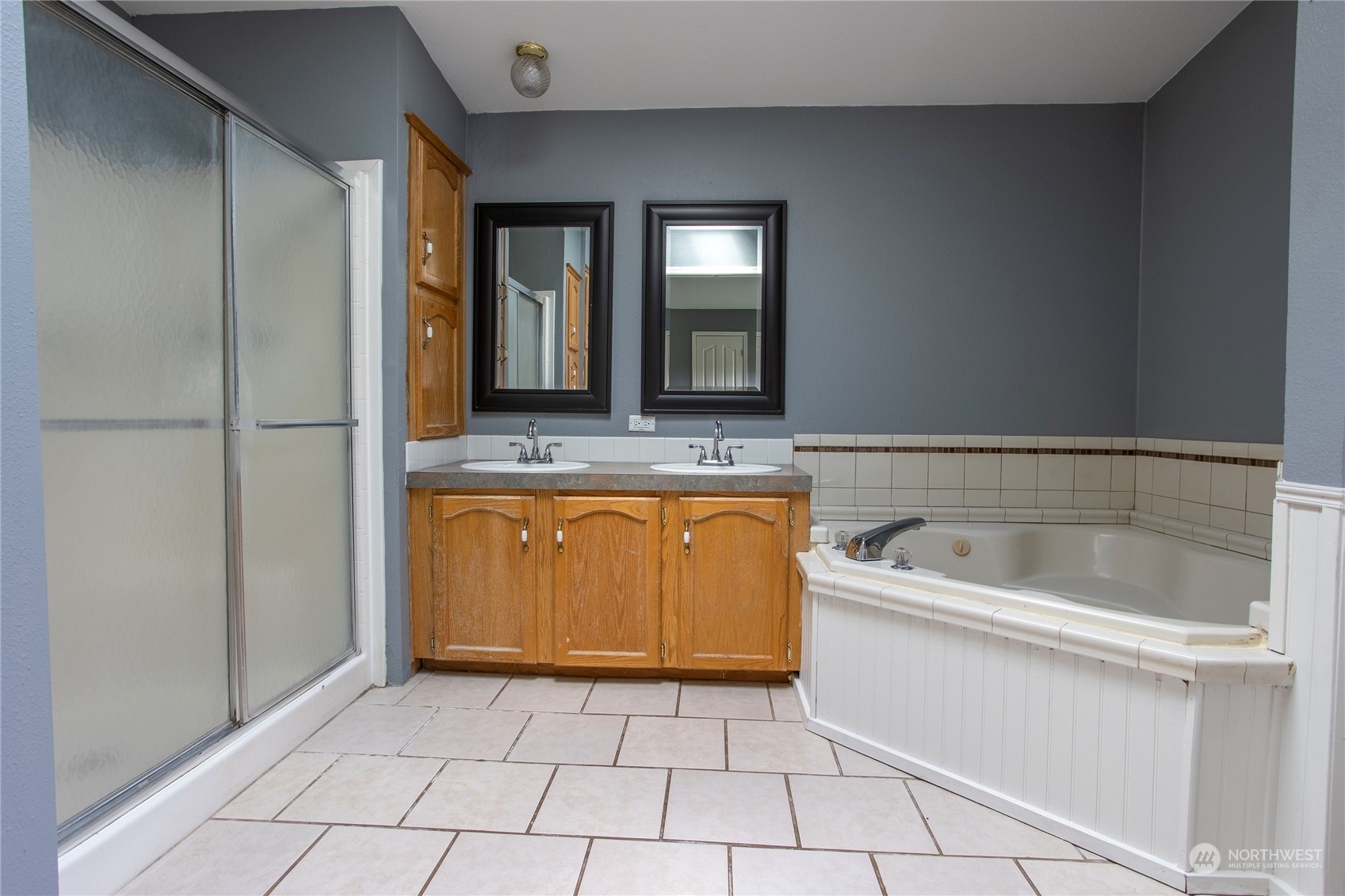 219 Lindbeck Road Winlock, WA 98596 - Photo 16 of 35 a bathroom with a granite countertop sink mirror and bathtub