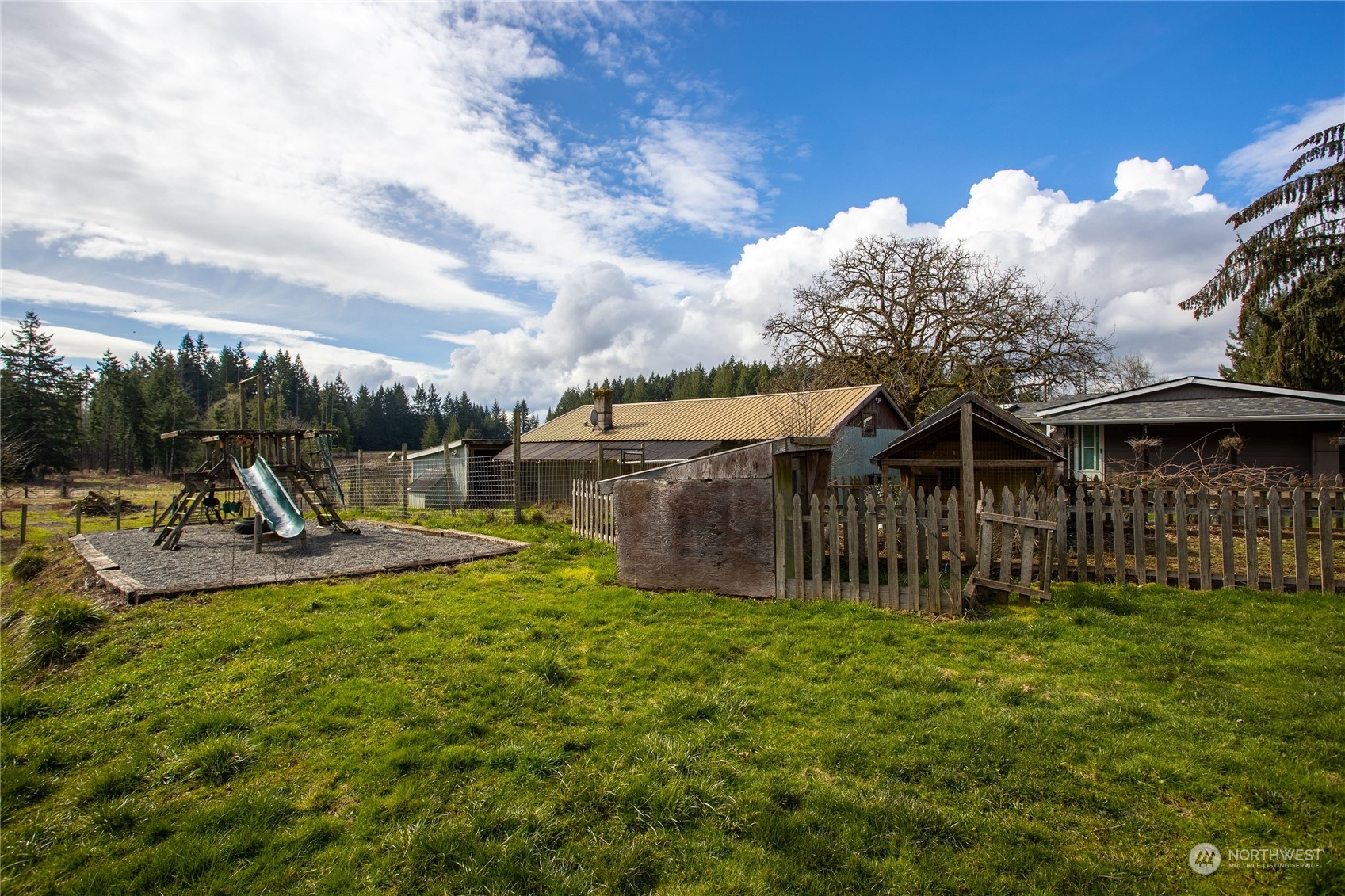 219 Lindbeck Road Winlock, WA 98596 - Photo 24 of 35 a view of a house with backyard and sitting area