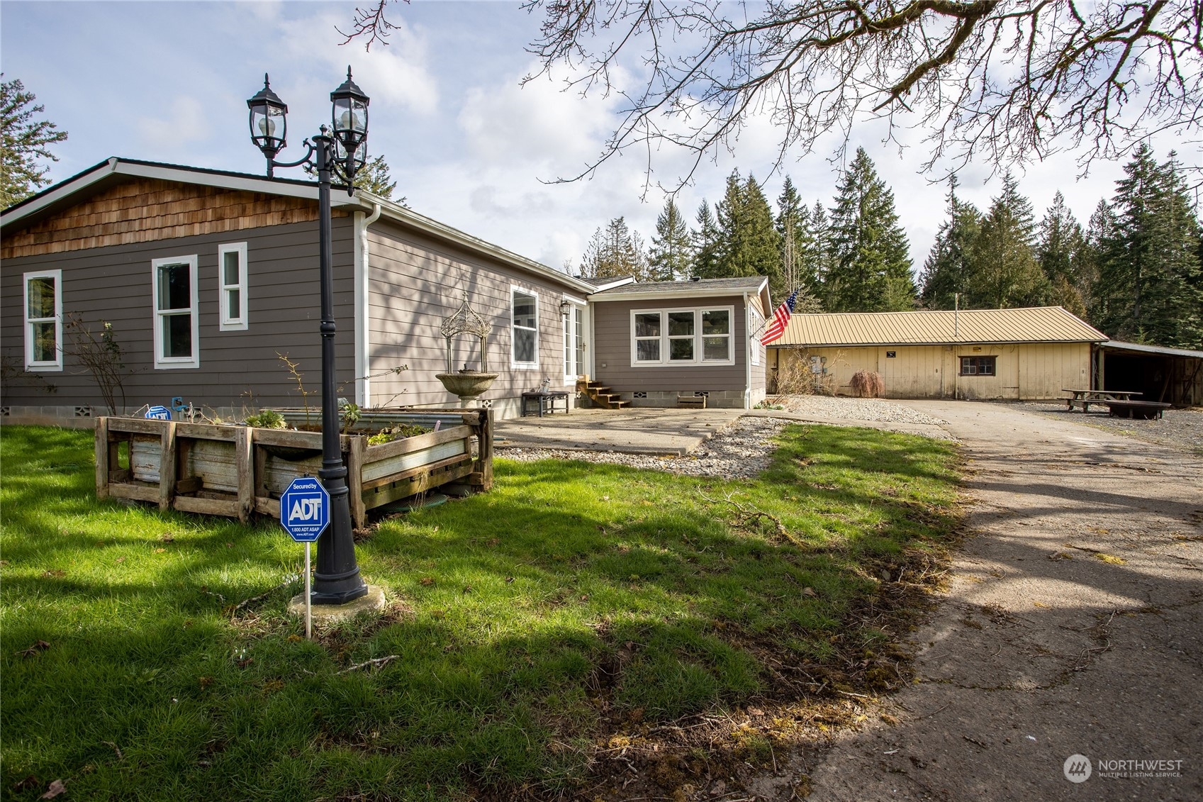 219 Lindbeck Road Winlock, WA 98596 - Photo 27 of 35 a view of a house with a yard porch and sitting area