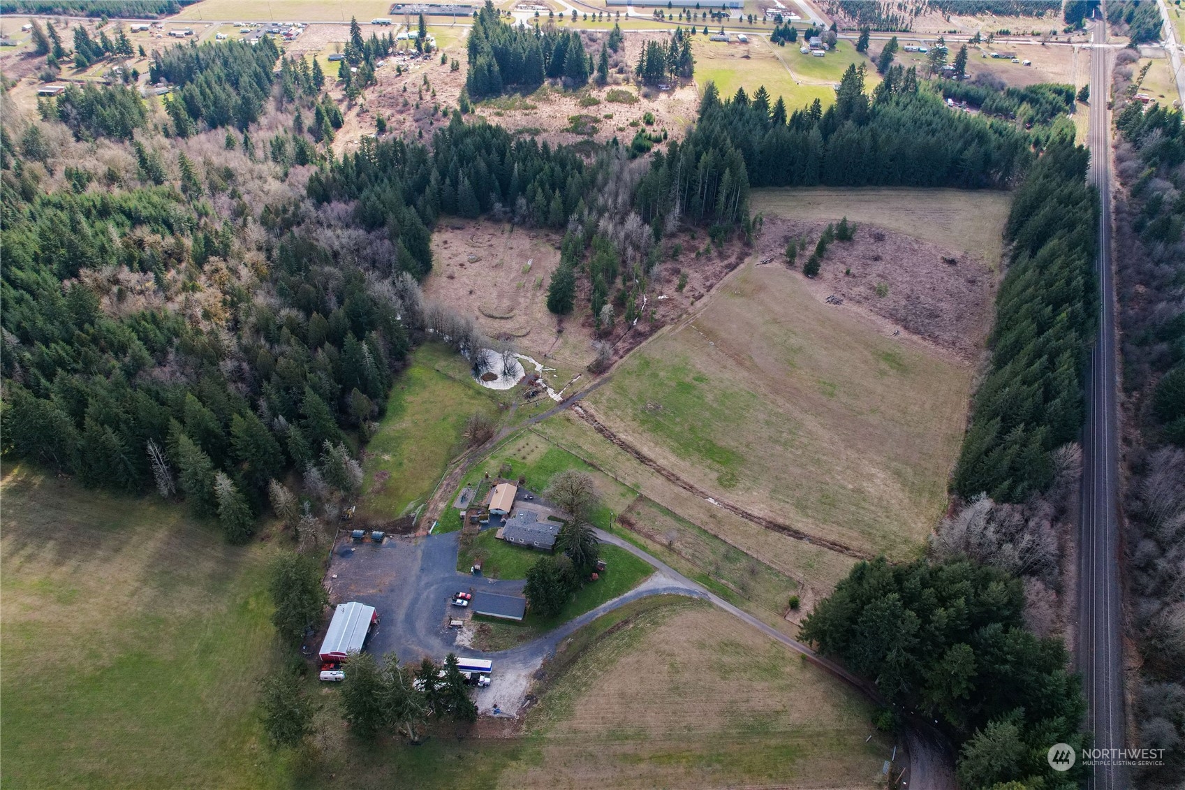 219 Lindbeck Road Winlock, WA 98596 - Photo 28 of 35 an aerial view of a house with a yard