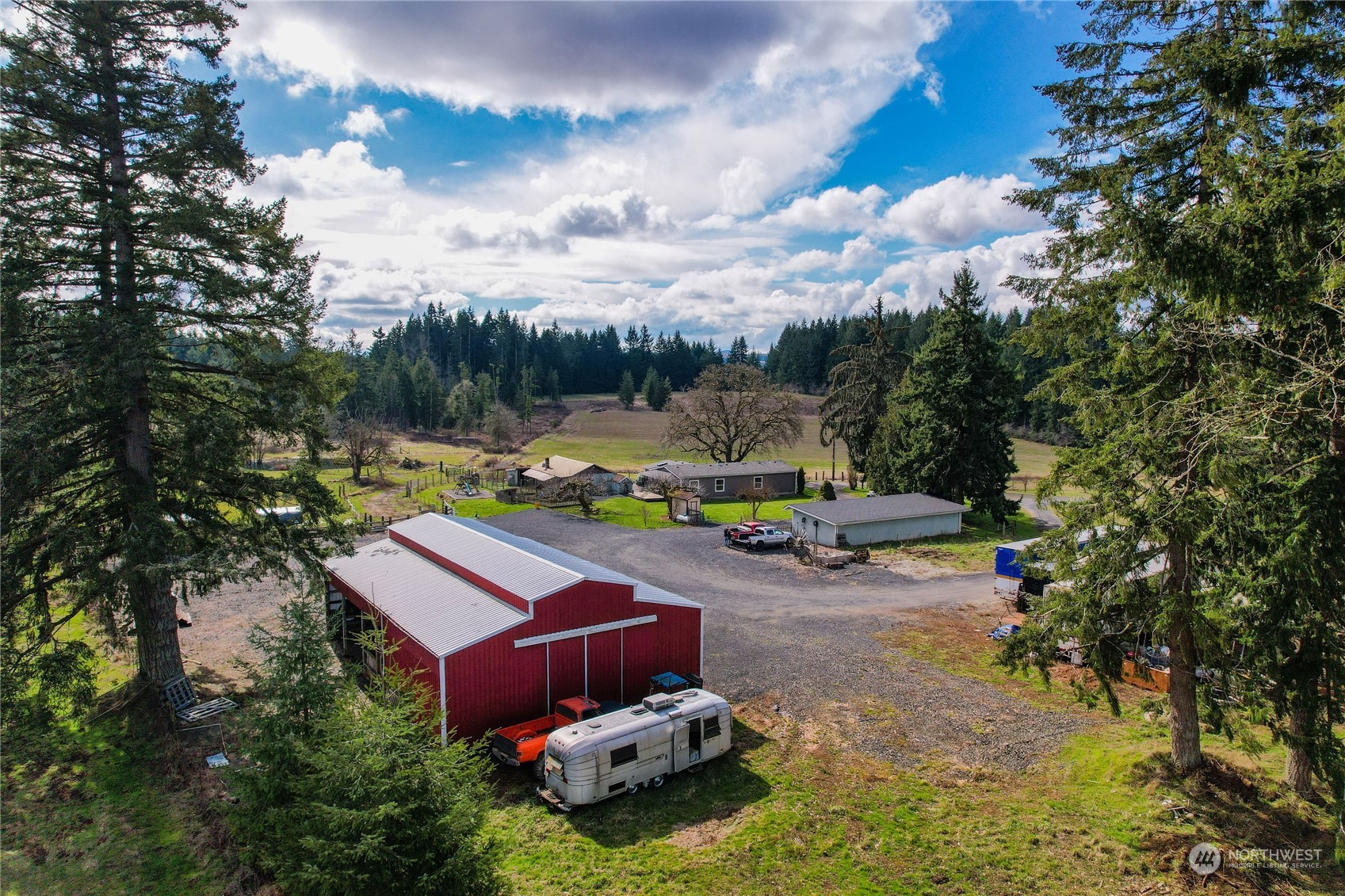 219 Lindbeck Road Winlock, WA 98596 - Photo 3 of 35 a backyard of a house with table and chairs