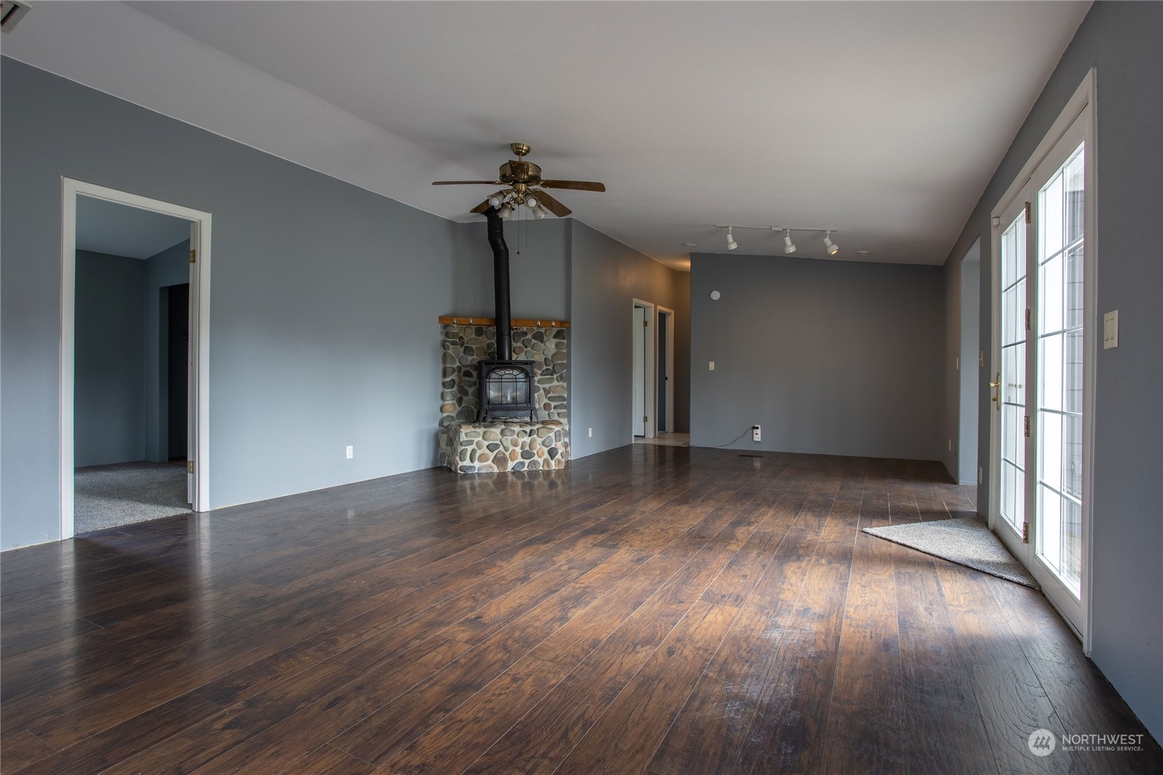 219 Lindbeck Road Winlock, WA 98596 - Photo 9 of 35 wooden floor in an empty room with a window