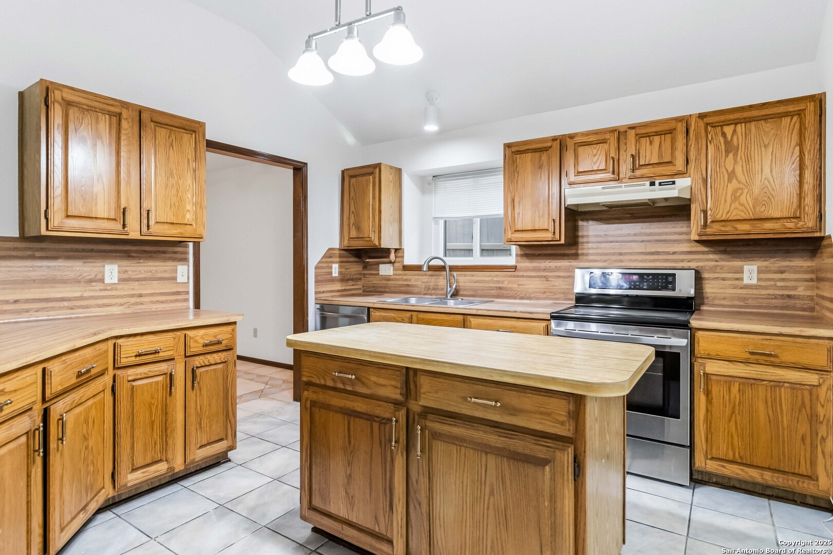 14658 Highland Ridge San Antonio, TX 78233 - Photo 13 of 35 a kitchen with stainless steel appliances granite countertop a stove sink and cabinets