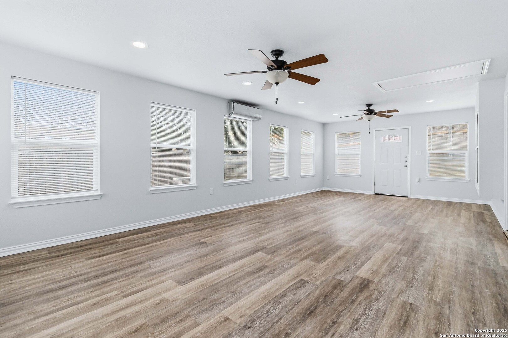 14658 Highland Ridge San Antonio, TX 78233 - Photo 6 of 35 a view of empty room with wooden floor and fan