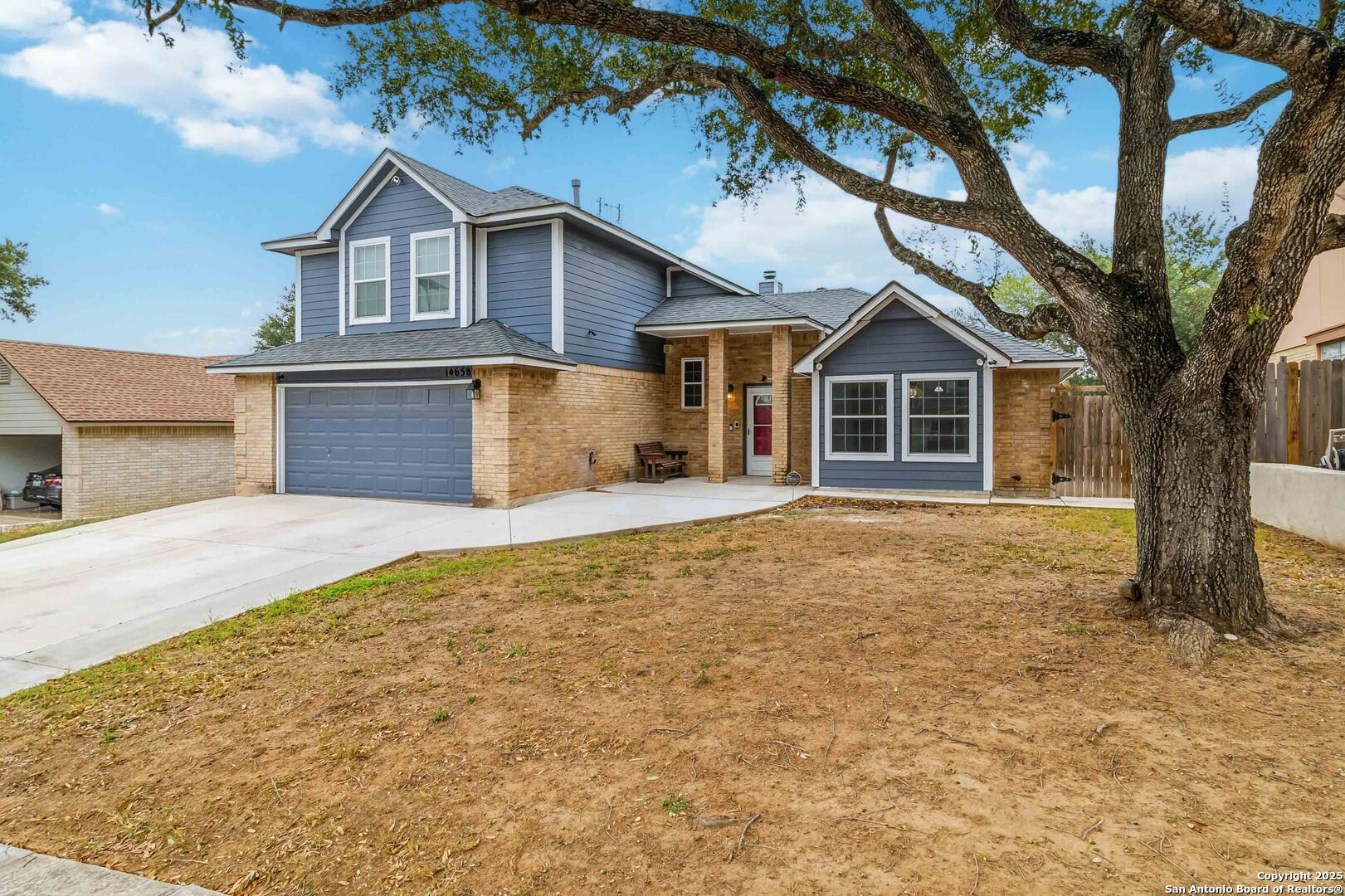 14658 Highland Ridge San Antonio, TX 78233 - Photo 8 of 35 a front view of a house with a yard and garage