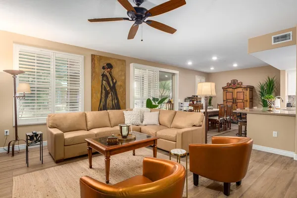 a living room with furniture and a large window